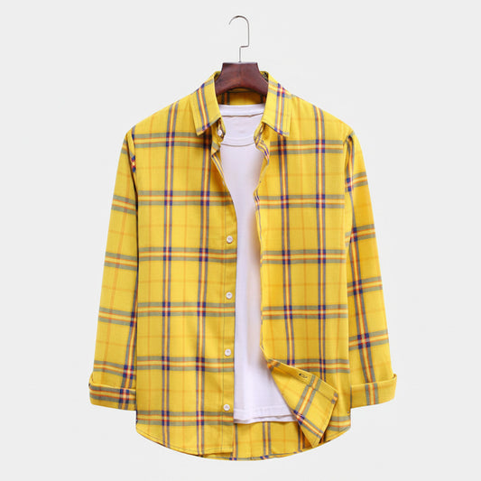 Yellow plaid shirt on a hanger against a white background