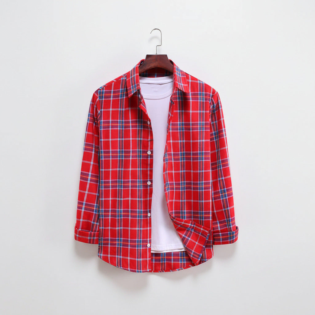 Red and blue plaid shirt on a hanger against a white background