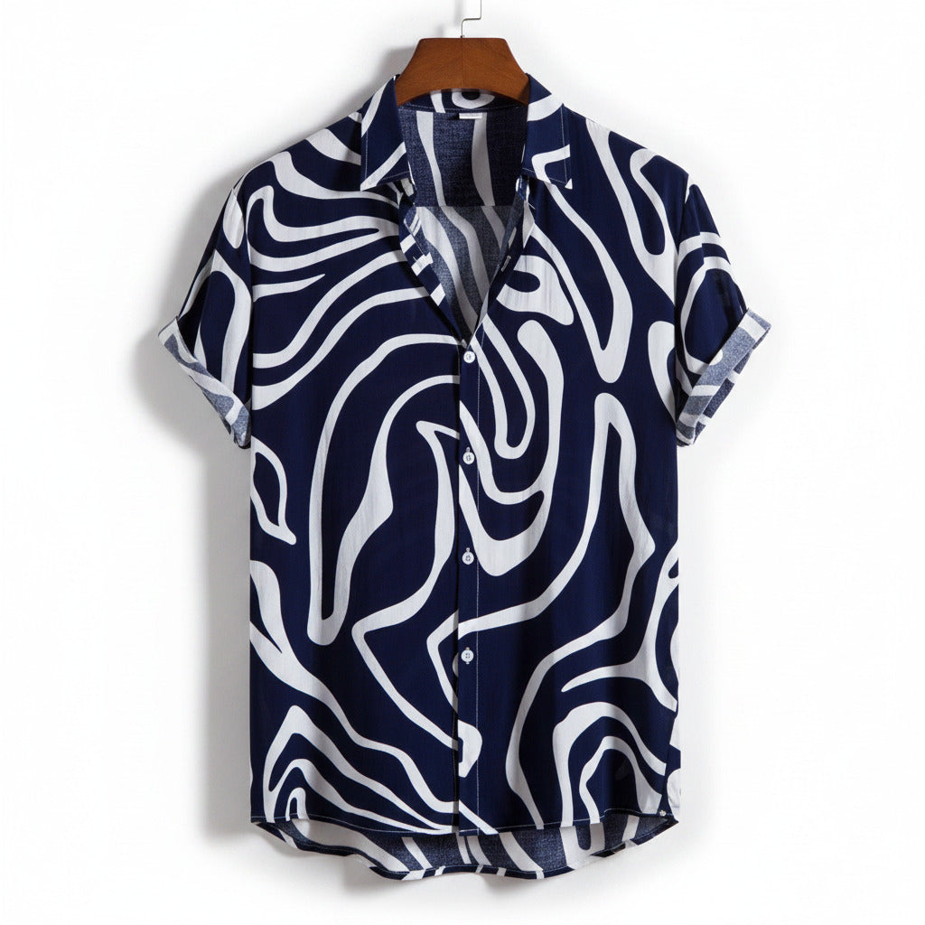 Navy and white patterned shirt on a hanger with a white background