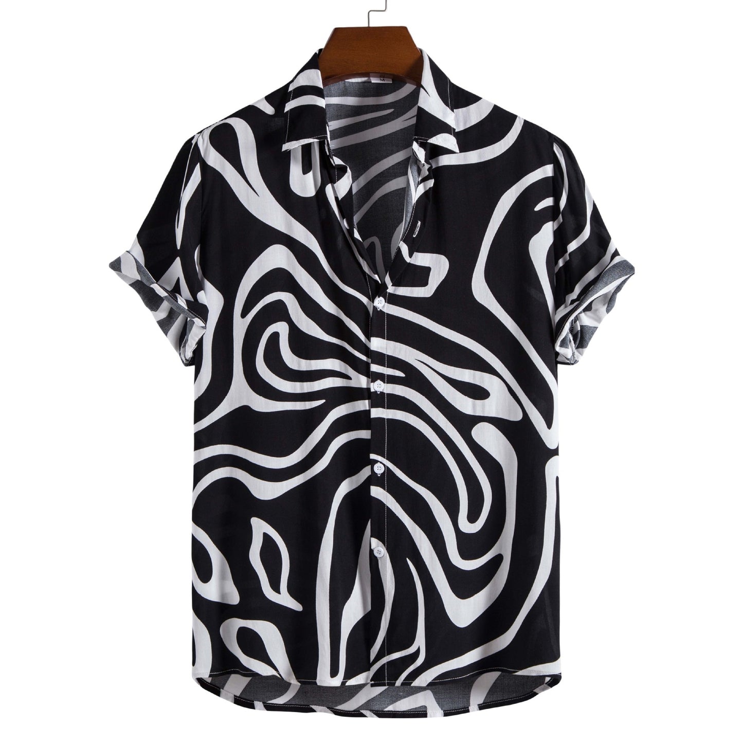 Black and white patterned shirt on a hanger with a white background