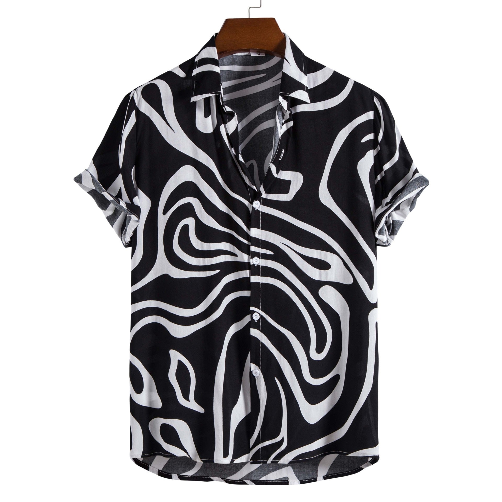 Black and white patterned shirt on a hanger with a white background
