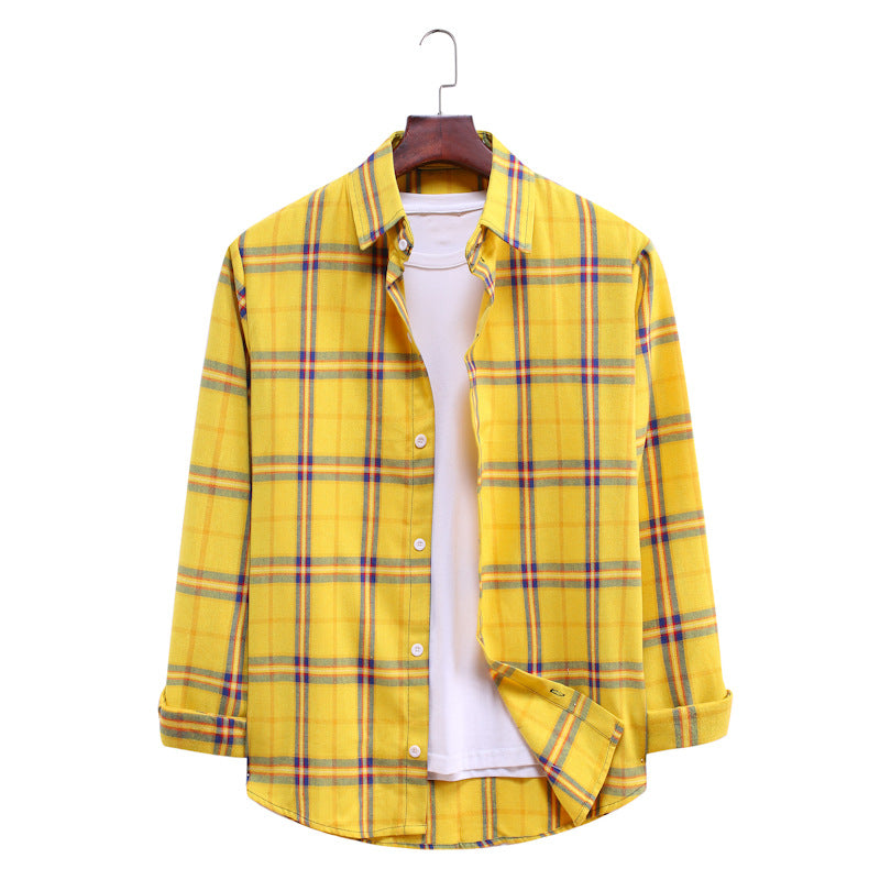 Yellow plaid shirt on a hanger against a white background