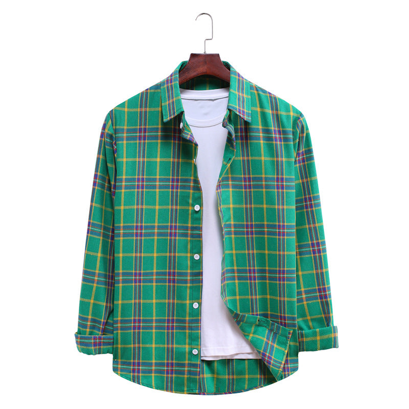 Green plaid shirt on a hanger against a white background