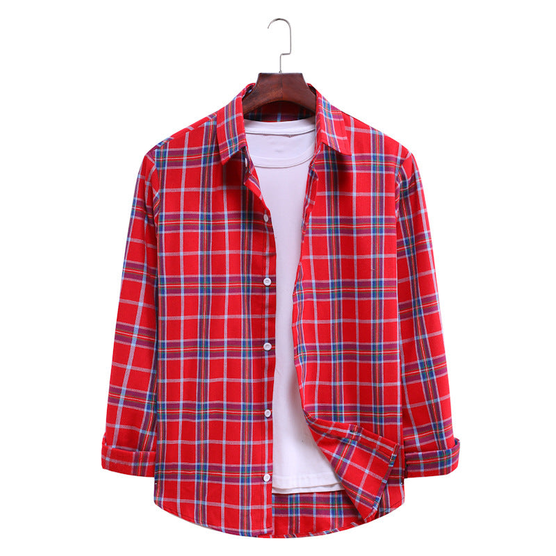 Red and blue plaid shirt on a hanger against a white background