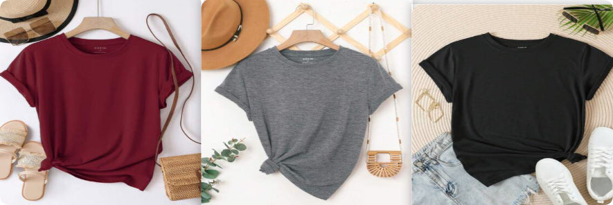 Three shirts in different colors displayed on hangers with a neutral background.