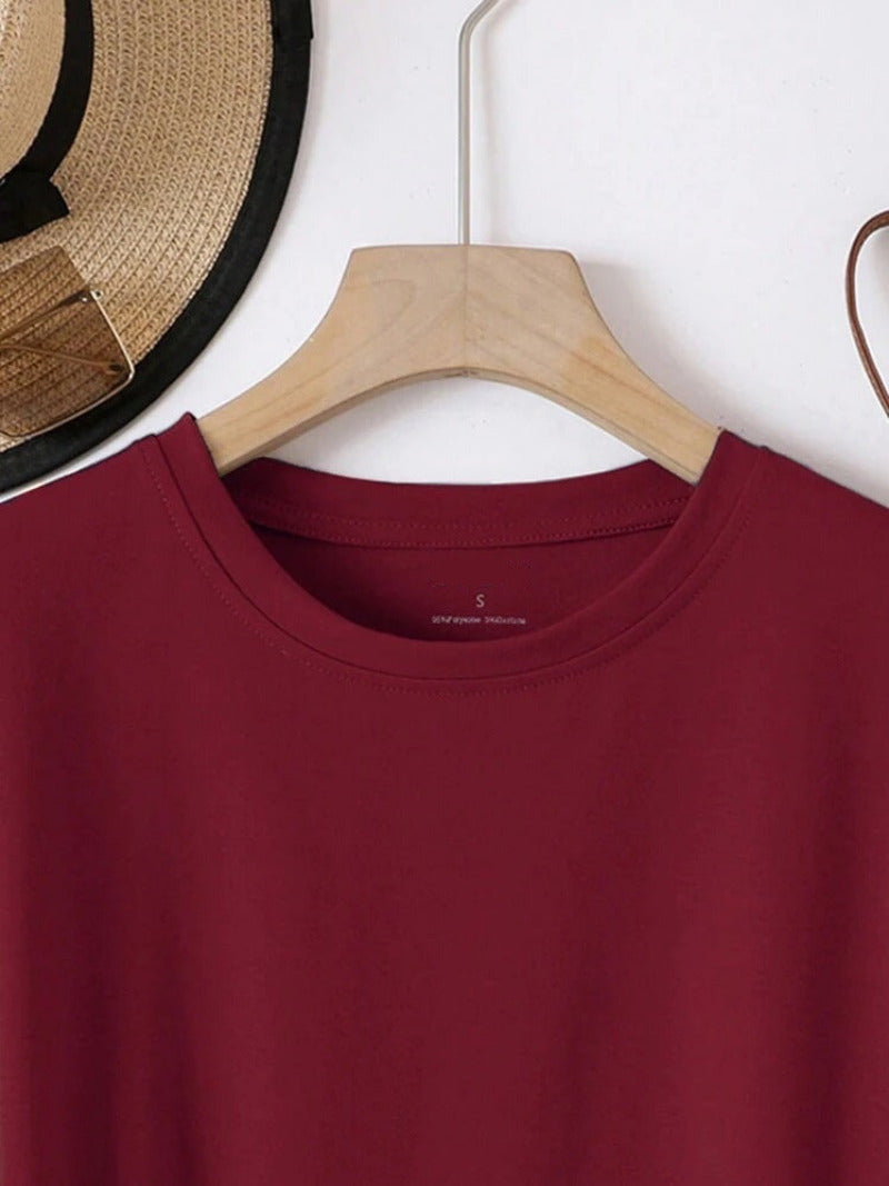 Maroon shirt on a wooden hanger with 'SHEIN' label, hat in the background