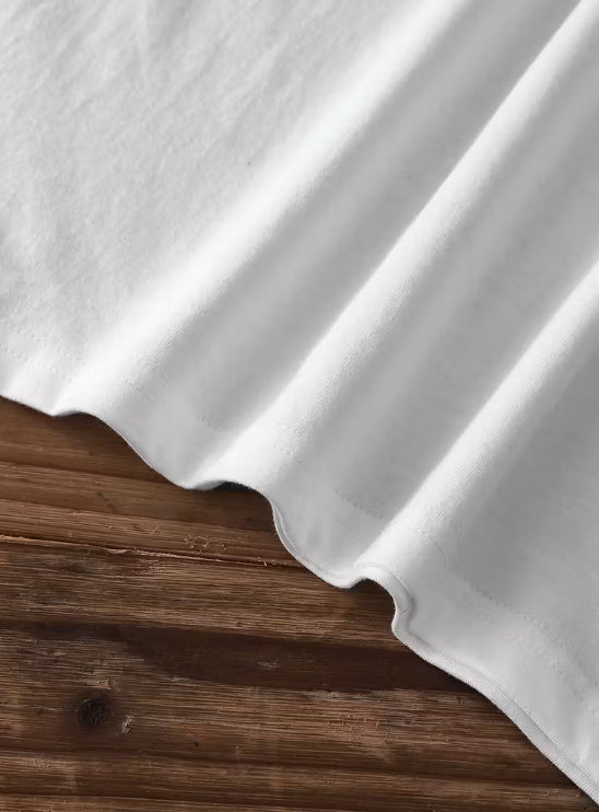 White fabric draped over a wooden surface