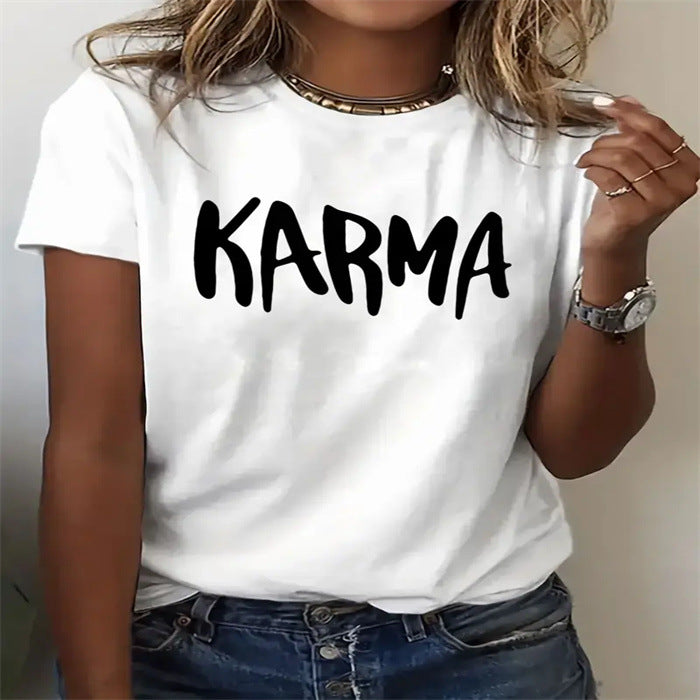 White t-shirt with 'Karma' text worn by a person