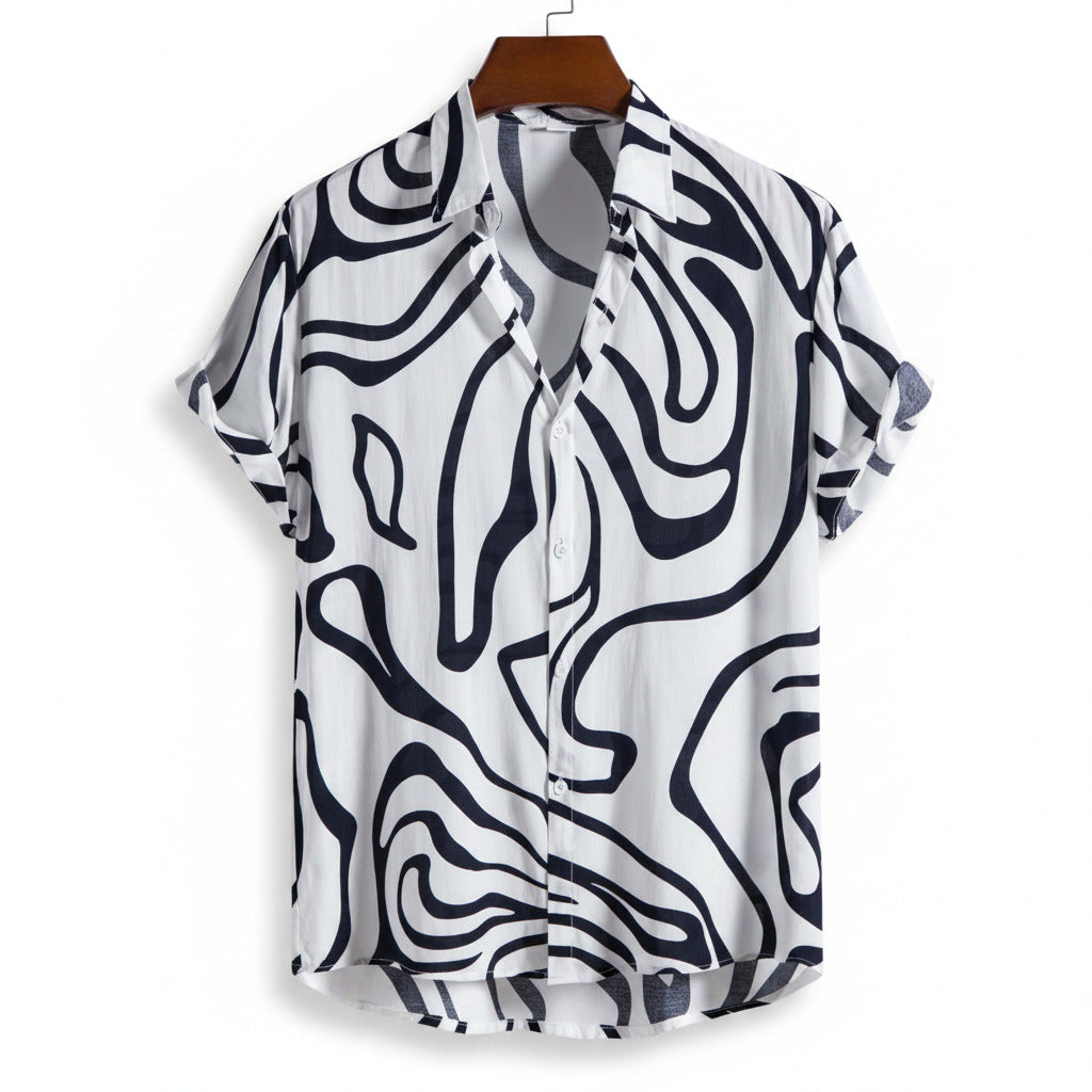 White shirt with black abstract pattern on a hanger against a white background