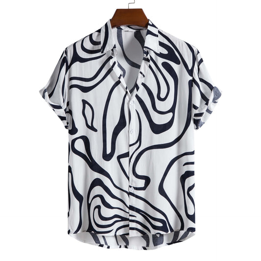 White shirt with black abstract pattern on a hanger against a white background