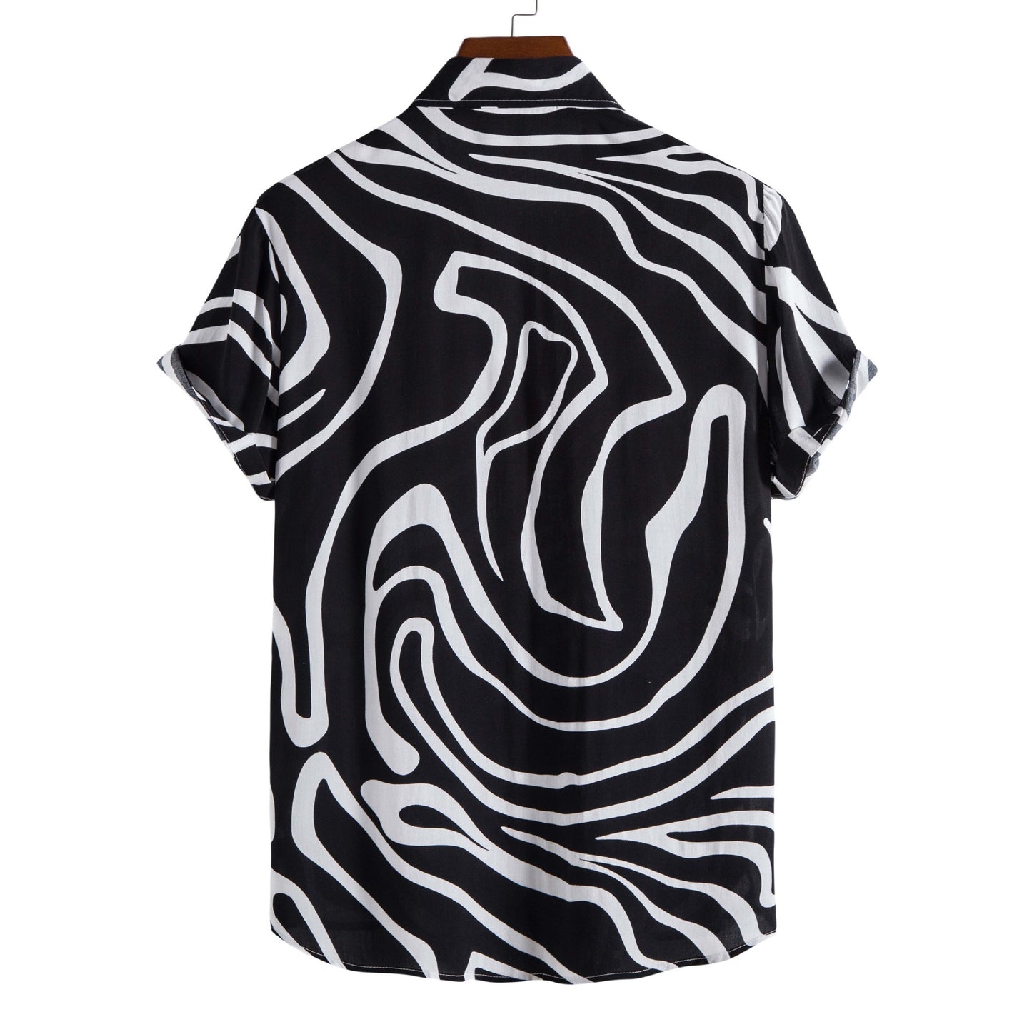 Black and white patterned shirt on a hanger with a white background