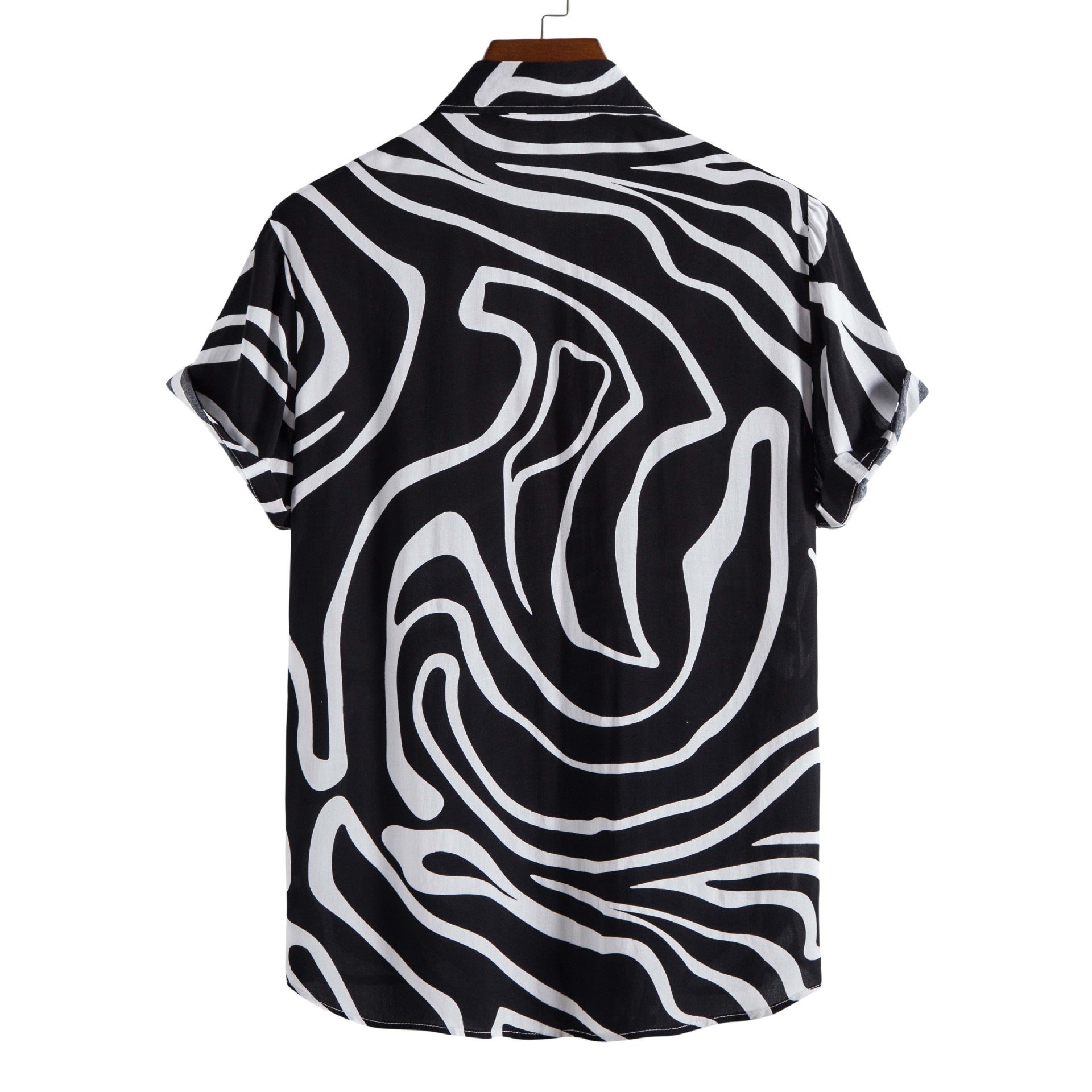 Black and white patterned shirt on a hanger with a white background