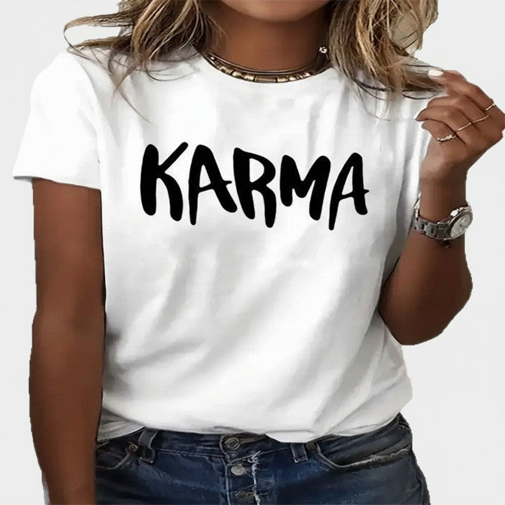 White t-shirt with 'Karma' text worn by a person