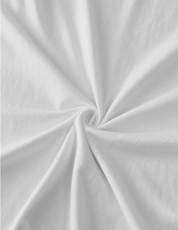 Close-up of white fabric with a swirl pattern