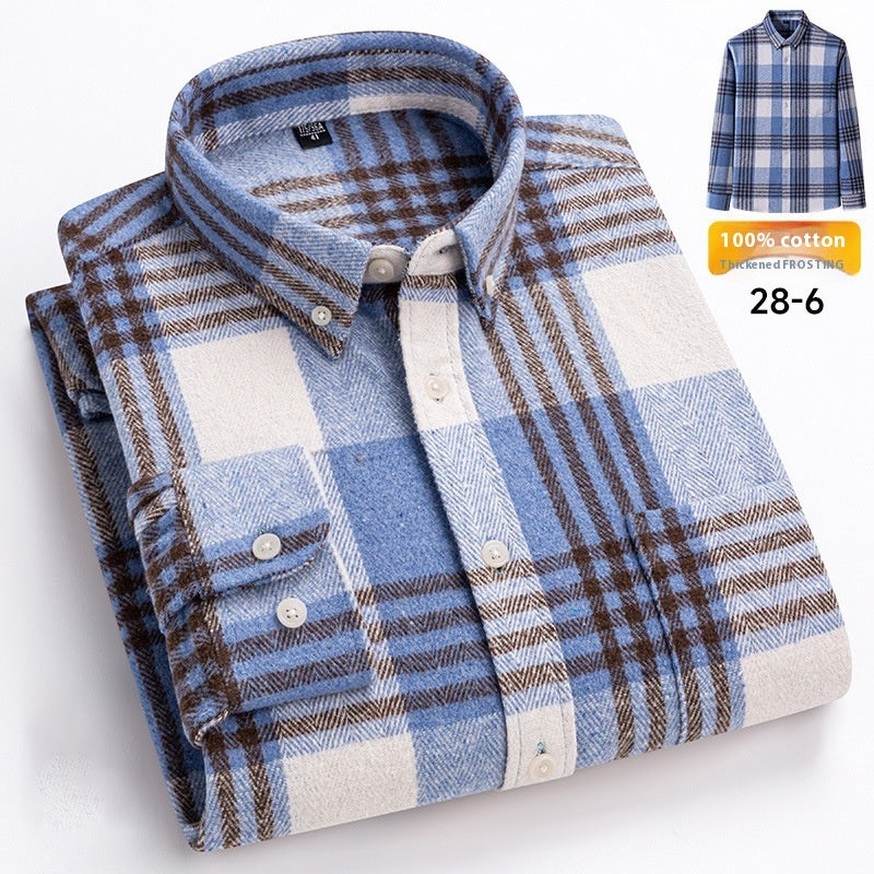 Folded plaid shirt with blue, brown, and white pattern on a light gray background