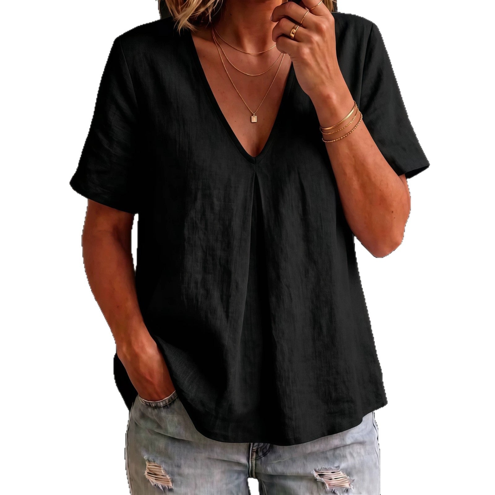Person wearing a black t-shirt and ripped jeans on a white background
